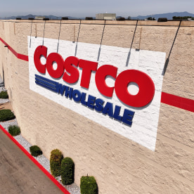 Costco logo is displayed on the exterior of a Costco store.